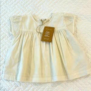 NWT short-sleeved ivory blouse with button back (2/3 T)